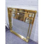 A LARGE RECTANGULAR BEVELLED EDGE WALL MIRROR, IN GILT FRAME WITH MIRROR GLASS INSERT