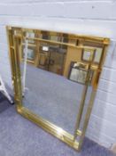 A LARGE RECTANGULAR BEVELLED EDGE WALL MIRROR, IN GILT FRAME WITH MIRROR GLASS INSERT