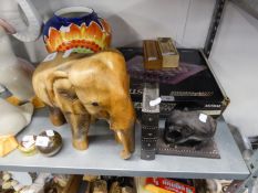 WELL-CARVED LIGHT WOOD MODEL OF AN ELEPHANT AND AN EBONY ELEPHANT SINGLE BOOKEND (2)