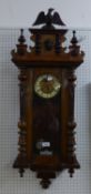 VIENNA STYLE SPRING DRIVEN WALL CLOCK, with grid-iron pendulum and eagle pediment, 39 ½? high