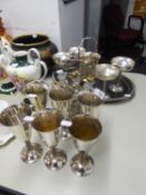 AN OVAL ELECTROPLATE CUTLERY TRAY, SIX E.P. GOBLETS, AN E.P. AND GLASS SIX PIECE CRUET SET, 4 E.P.