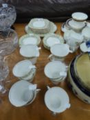 AN ART DECO STYLE 'ROSLYN' CHINA TEA SERVICE IN GREEN AND GOLD DECORATION (30 PIECES) TO INCLUDE;