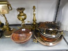 FLAT COPPER TWO HANDLED PANS; A BRASS KETTLE; BRASS LAMPS; A BRASS TRIVET STAND AND A WALKING