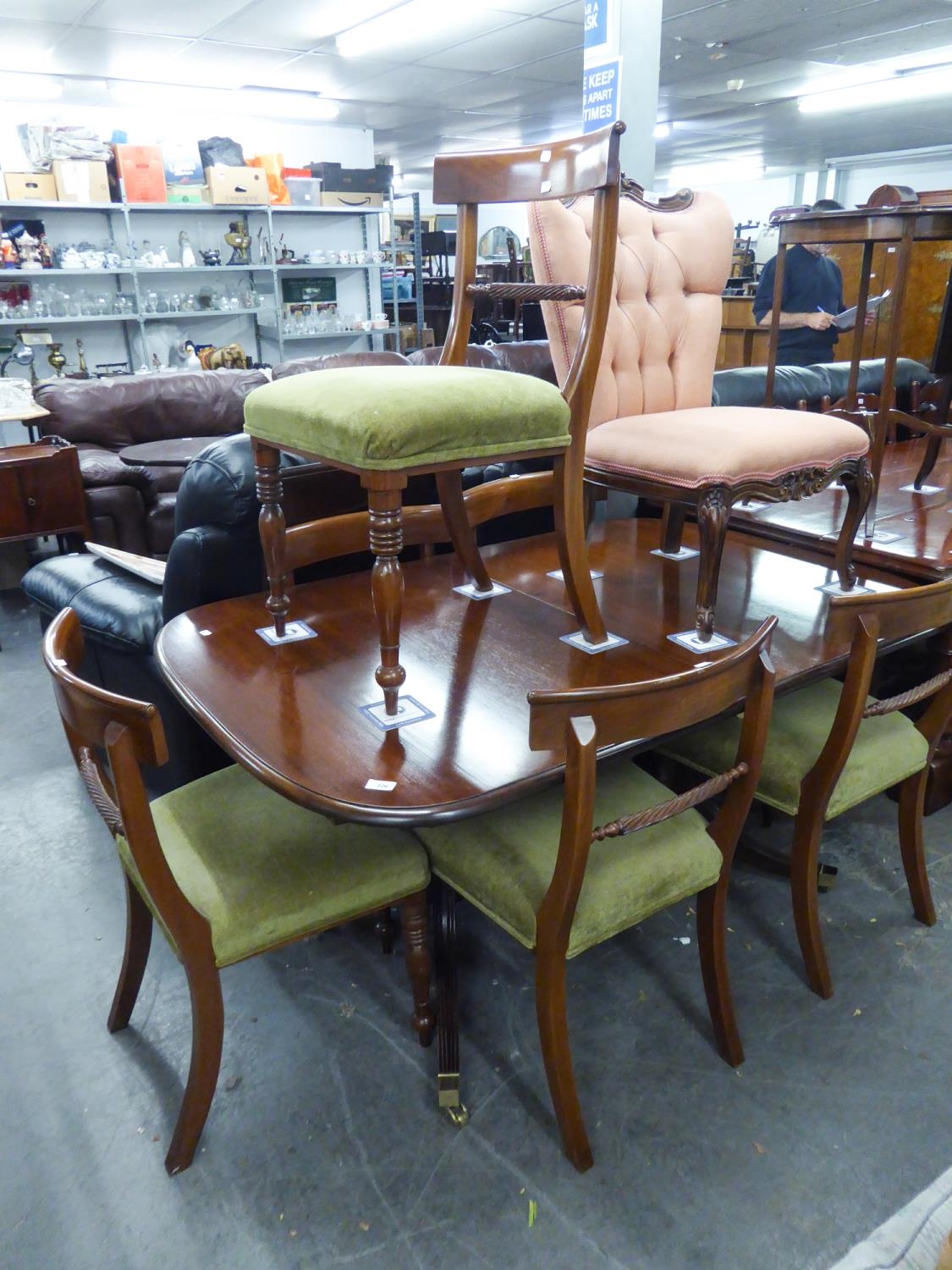 A MODERN REPRODUCTION REGENCY REVIVAL DINING TABLE WITH EXTRA LEAF AND SIX DINING CHAIRS, BY BRIGHTS