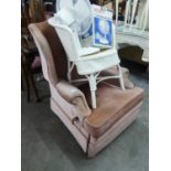 A WINGED LOUNGE CHAIR, COVERED IN PINK VELVET WITH MANUAL RECLINING ACTION, WITH EXTENDING LEG REST