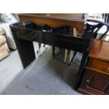 A BLACK GLOSS CONSOLE TABLE, WITH ONE LONG DRAWER, ON END PANEL SUPPORTS