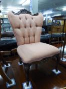 A REPRODUCTION PINK FABRIC COVERED NURSING CHAIR