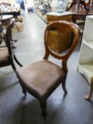 A SET OF FIVE VICTORIAN MAHOGANY BALLOON BACK DINING CHAIRS ON TURNED TAPERING  FRONT SUPPORTS (5)