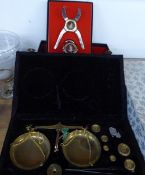 A CASED BRASS BALANCE WITH WEIGHTS, TOGETHER WITH V CLICQUOT LOUSARDINI ? CIGAR CUTTER AND BOTTLE