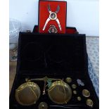 A CASED BRASS BALANCE WITH WEIGHTS, TOGETHER WITH V CLICQUOT LOUSARDINI ? CIGAR CUTTER AND BOTTLE