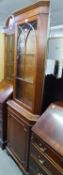 A REPRODUCTION MAHOGANY FLOOR STANDING CORNER CUPBOARD