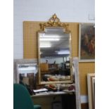 A GILT PIER MIRROR, WITH STEPPED TOP WITH ORNATE FOLIATE OPEN SCROLL PEDIMENT, THE FRAME WITH MIRROR