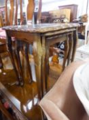 A NEST OF THREE WALNUT OBLONG COFFEE TABLES, WITH INSET LOOSE PLATE GLASS PROTECTORS, CARVED