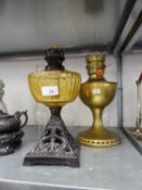VICTORIAN OIL TABLE LAMP WITH BLACK CAST IRON PIERCED SQUAR BASE, YELLOW GLASS RESERVOIR AND THE