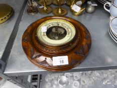 EDWARDIAN CARVED WALNUT CIRCULAR ANEROID BAROMETER WITH VISIBLE WORKS