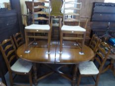 AN ERCOL D-END EXTENDING DINING TABLE WITH FOLD-AWAY LEAF AND SIX MATCHING DINING CHAIRS (4 + 2)