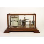 BAROGRAPH in mahogany and glazed case and a BOX OF ASSOCIATED CHARTS