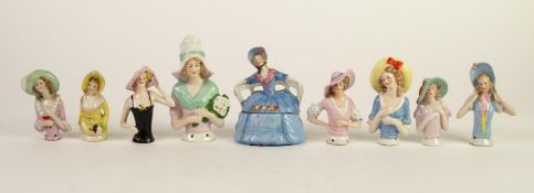 EIGHT EARLY TWENTIETH CENTURY CHINA CUSHION HALF FIGURES OF LADIES IN WIDE BRIM BONNETS, the largest