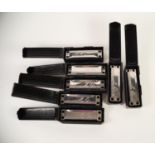 FOUR BOXED 'LEE OSKAR' BY TOMBO MELODY MAKER HARMONICAS in the key of  A, C, D, AND G.  each in