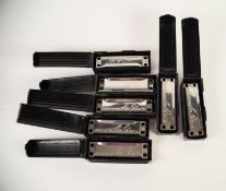 FOUR BOXED 'LEE OSKAR' BY TOMBO MELODY MAKER HARMONICAS in the key of  A, C, D, AND G.  each in