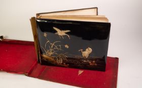 EARLY TWENTIETH CENTURY JAPANESE BLACK LACQUEUR AND SHIBAYAMA BOUND ALBUM OF ALBUMEN PHOTOGRAPHS