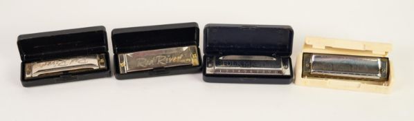 TWO BOXED 'RED RIVER' SMALL HARMONICAS, in the key of 'D' AND 'G', A BOXED FOLK MASTER DITTO key