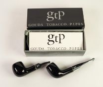 TWO GOUDA TOBACCO GLAZED CLAY SMOKING PIPES, unused, with leaflets, silver draw string bags and