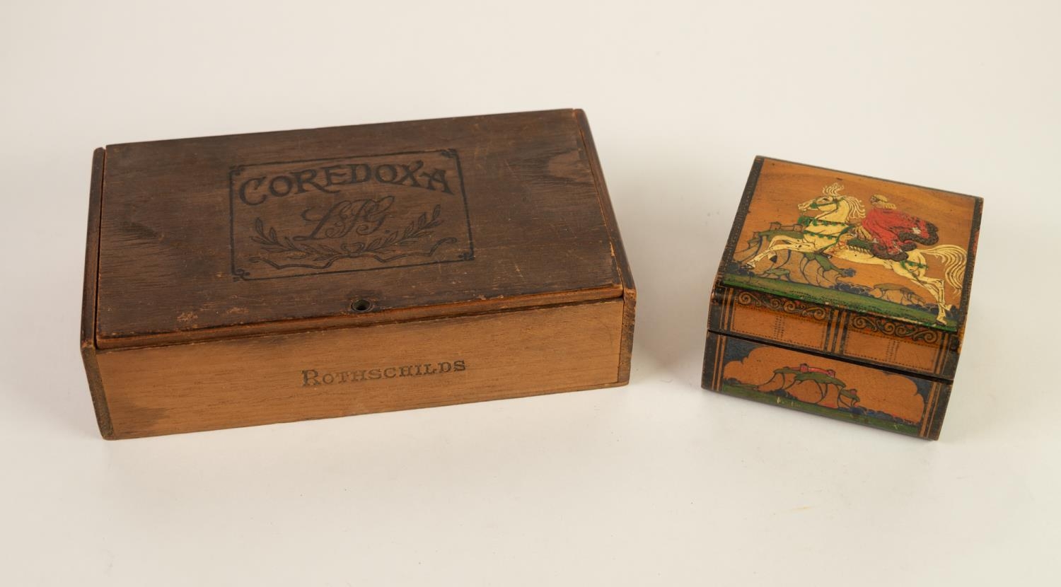 A CEDAR LINED WOODEN TABLE CIGARETTE BOX, the hinged lid. painted with medieval figure in a red