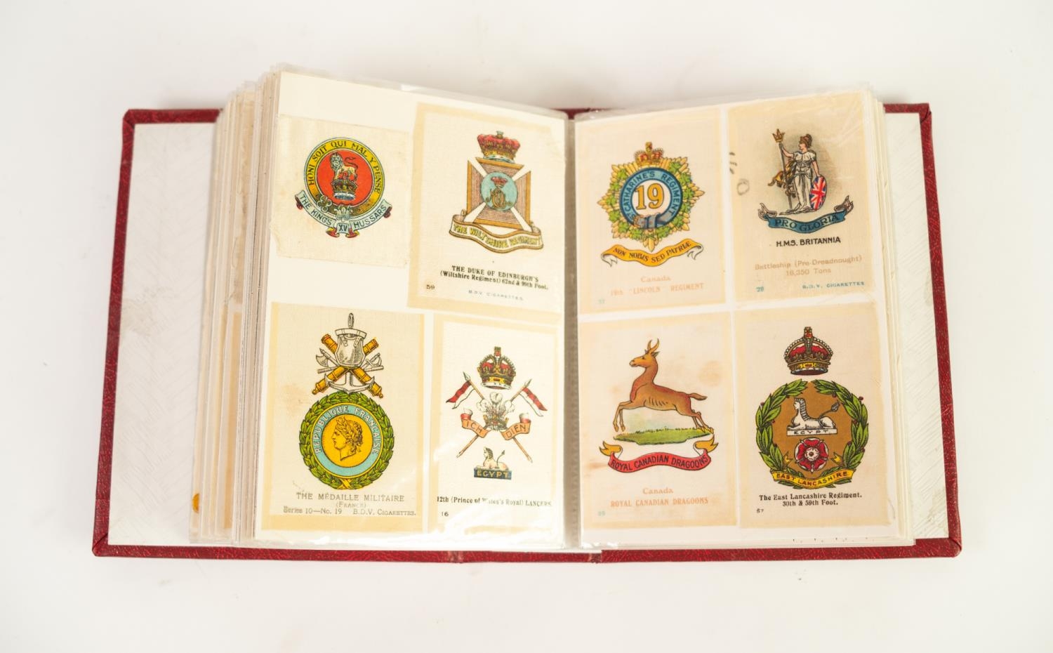 SMALL ALBUM CONTAINING A SELECTION OF BDV AND OTHERS CIGARETTE SILKS, in various sizes to include 24