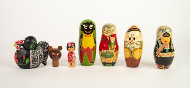 THREE RUSSIAN DECORATED WOOD NESTING FIGURES/DOLLS, depicting girl in costume, comic cat character