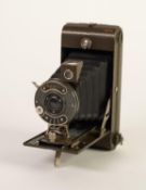 ENSIGN 'GREYHOUND' BELLOWS FOLDING ROLL FILM CAMERA, with Houghton and Butcher 'Syncro' shutter