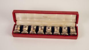 SET OF EIGHT CARTIER SMALL STERLING SILVER PEPPERETTES, of octagonal form with screw tops, bases