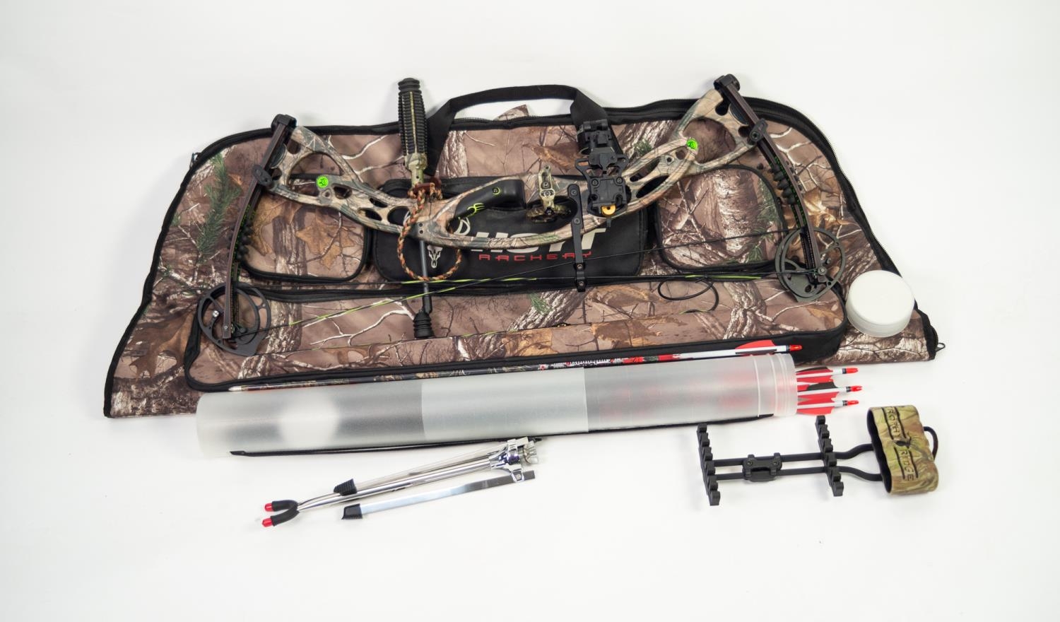 LEFT HANDED HOYT BONE COLLECTOR COLLECTOR?S EDITION COMPOUND BOW, IN CAMO, together with INSTRUCTION