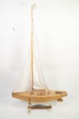 MID 20th CENTURY, PROBABLY KIT BUILT, VARNISHED AND PAINTED WOOD POND YACHT, white painted underside