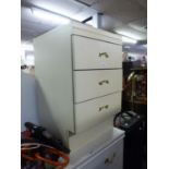 A WHITE FINISH SMALL CHEST OF THREE SHORT DRAWERS