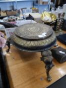 TWENTIETH CENTURY INDIAN CAST BRASS CIRCULAR URN STAND, WITH BAS RELIEF FOLIATE DECORATION AND