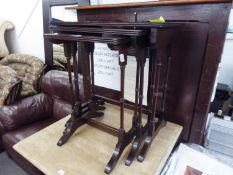 A NEST OF THREE REPRODUCTION MAHOGANY COFFEE TABLES