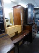 A CARVED DARK STAINED CORNER CUPBOARD AND A LONG NARROW SIDE TABLE ON TURNED SUPPORTS (2)