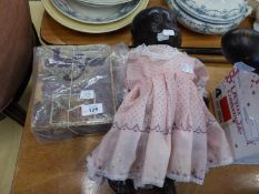 MID TWENTIETH CENTURY MOULDED COMPOSITION BLACK BABY DOLL, WITH SLEEPING EYES, ON A FIVE PIECE