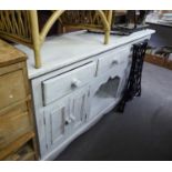 A WHITE PAINTED DRESSER WITH A ROW OF THREE SHORT FRIEZE DRAWERS OVER A CENTRE OPEN COMPARTMENT,