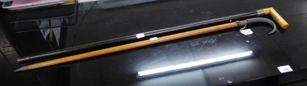EARLY TWENTIETH CENTURY EBONY WALKING STICK WITH TAU SHAPED BLOND-WOOD HANDLE AND SILVER FERRULE AND