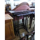 A NEST OF THREE REPRODUCTION MAHOGANY COFFEE TABLES