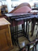 A NEST OF THREE REPRODUCTION MAHOGANY COFFEE TABLES