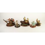 THREE WORCESTER ORNAMENTAL STUDIO RESIN MODELS OF ANIMALS, comprising: TWO ROBINS ON A WATERING CAN,