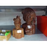 A CARVED WOODEN BUST OF A SEMI-NUDE WOMAN AND A SMALLER SIMILAR BUST OF A MAN, BOTH STAMPED 'BALI'