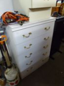 A WHITE FINISH CHEST OF FIVE LONG DRAWERS AND A BEDSIDE CUPBOARD WITH DRAWER ABOVE