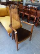 1920?S WALNUT BERGÈRE OPEN ARMCHAIR, WITH TEAR SHAPED CANE PANELLED BACK, STUFFED-OVER SEAT IN BROWN