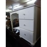A WHITE FINISH SINGLE PEDESTAL DRESSING TABLE OF THREE DRAWERS