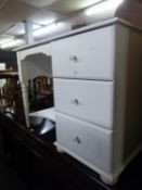 A WHITE FINISH SINGLE PEDESTAL DRESSING TABLE OF THREE DRAWERS