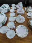 'ROYAL SUTHERLAND' CHINA TEA SERVICE IN PINK AND GILT DECORATION, 33 PIECES, TO INCLUDE; 11 TEACUPS,